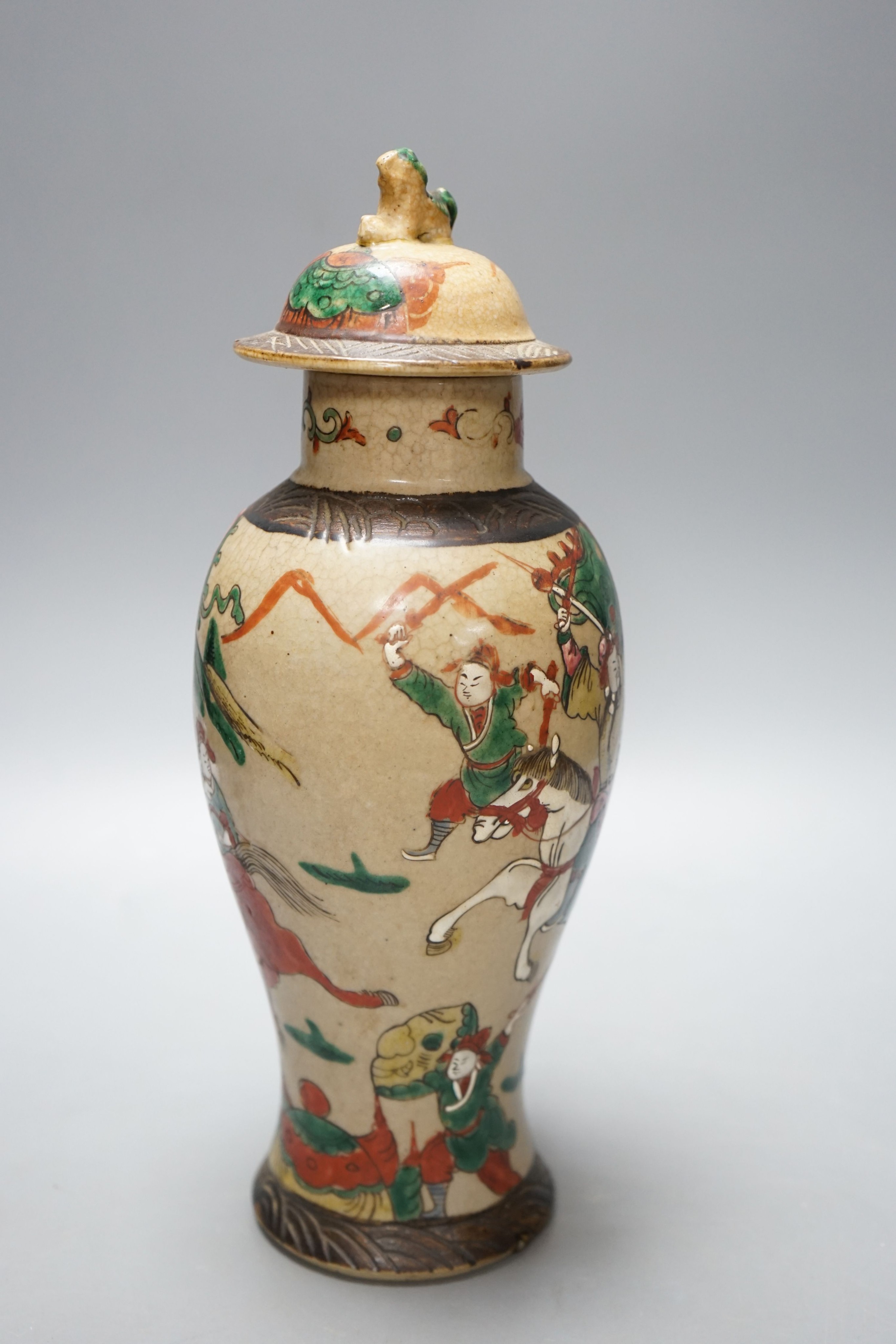 A late 19th century Chinese crackle glaze famille rose baluster vase and cover 30cm